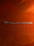 Sterling silver chunky chain displayed on an orange velvet backdrop.